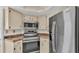 Kitchen features stainless steel appliances and ample cabinetry at 1555 Archers Path, Lakeland, FL 33809