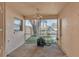 Screened porch with ceiling fan and access to backyard at 1555 Archers Path, Lakeland, FL 33809