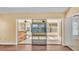 Sunroom with sliding glass doors and wood bar at 1555 Archers Path, Lakeland, FL 33809