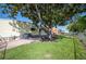Landscaped backyard with mature tree and spacious lawn at 1610 Reynolds Rd # 79, Lakeland, FL 33801