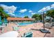Relaxing community pool area with surrounding lounge chairs at 1610 Reynolds Rd # 79, Lakeland, FL 33801