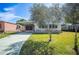Single-wide yellow manufactured home with covered carport at 1610 Reynolds Rd # 79, Lakeland, FL 33801