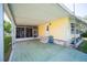 Covered patio with access from the home's side entrance at 1610 Reynolds Rd # 79, Lakeland, FL 33801