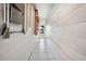Long hallway with tiled floor and access to backyard at 1610 Reynolds Rd # 79, Lakeland, FL 33801