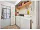 Convenient laundry room with washer, dryer, and storage at 1610 Reynolds Rd # 79, Lakeland, FL 33801
