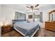 Large main bedroom with ceiling fan and wood floors at 1610 Reynolds Rd # 79, Lakeland, FL 33801