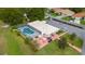 Community pool area with patio furniture and cabanas at 202 Golf Aire Blvd, Winter Haven, FL 33884