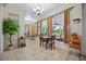 Sunroom with tile floors, seating area, and large windows at 202 Golf Aire Blvd, Winter Haven, FL 33884