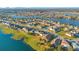 An extensive aerial view showcases a large lakefront community with various housing styles at 2199 Ontario Way, Lakeland, FL 33805