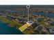 Aerial view of a house and property highlighted on a lakefront lot in a quiet community at 2199 Ontario Way, Lakeland, FL 33805