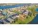 An aerial view of a lakefront community showcasing houses with lush landscaping at 2199 Ontario Way, Lakeland, FL 33805