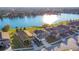Two-story house with a three-car garage and a large backyard backing up to a lake at 2199 Ontario Way, Lakeland, FL 33805