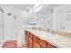Bathroom with double vanity and a walk-in shower at 2199 Ontario Way, Lakeland, FL 33805