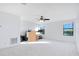 Large bedroom with a treadmill and lake view at 2199 Ontario Way, Lakeland, FL 33805