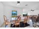 Dining room with table and chairs, offering a view of the lake at 2199 Ontario Way, Lakeland, FL 33805