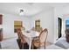 Bright dining room with a table for six and access to a back patio at 2199 Ontario Way, Lakeland, FL 33805