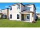 Two-story house with a backyard and lake view at 2199 Ontario Way, Lakeland, FL 33805