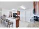 Kitchen with granite countertops, dark wood cabinets, and a breakfast bar at 2199 Ontario Way, Lakeland, FL 33805