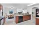 Open concept kitchen with granite countertops and a breakfast bar at 2199 Ontario Way, Lakeland, FL 33805