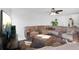 Spacious living room featuring a large sectional sofa and a big screen TV at 2199 Ontario Way, Lakeland, FL 33805