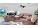 Living room with sectional sofa, large TV, and lake view at 2199 Ontario Way, Lakeland, FL 33805