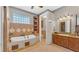 Spa-like bathroom with soaking tub, separate shower, and double vanity at 3206 Heron Cv, Winter Haven, FL 33884