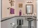 Elegant bathroom with black fixtures and granite at 3206 Heron Cv, Winter Haven, FL 33884