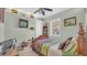 Cozy bedroom with a wooden bed frame and a window at 3206 Heron Cv, Winter Haven, FL 33884