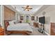 Main bedroom with large windows and a ceiling fan at 3206 Heron Cv, Winter Haven, FL 33884