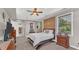 Main bedroom with ensuite bathroom access and a large TV at 3206 Heron Cv, Winter Haven, FL 33884