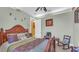 Charming bedroom with a wooden bed frame and artwork at 3206 Heron Cv, Winter Haven, FL 33884