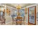 Cozy breakfast nook with a round table and chairs, near kitchen at 3206 Heron Cv, Winter Haven, FL 33884