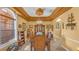 Elegant dining room features a large table, chandelier, and built-in hutch at 3206 Heron Cv, Winter Haven, FL 33884