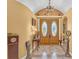 Elegant entryway with double doors and decorative ceiling at 3206 Heron Cv, Winter Haven, FL 33884