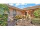 Front entry with a fountain and meticulously maintained landscaping at 3206 Heron Cv, Winter Haven, FL 33884