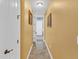 Bright hallway with tile floors leading to other rooms at 3206 Heron Cv, Winter Haven, FL 33884