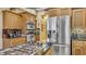 Kitchen features stainless steel appliances and granite countertops at 3206 Heron Cv, Winter Haven, FL 33884
