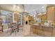 Open kitchen with breakfast nook, island, and stainless steel appliances at 3206 Heron Cv, Winter Haven, FL 33884