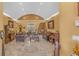 Spacious living room with a stone fireplace and high ceilings at 3206 Heron Cv, Winter Haven, FL 33884