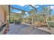 Screened patio with seating, dining area, and a swing at 3206 Heron Cv, Winter Haven, FL 33884