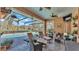 Relaxing screened-in pool area with lounge chairs and patio furniture at 3206 Heron Cv, Winter Haven, FL 33884