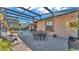 Relaxing pool and patio area with table and chairs at 3206 Heron Cv, Winter Haven, FL 33884