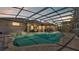 Inviting pool area with covered patio and spa at 3206 Heron Cv, Winter Haven, FL 33884