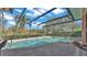 Inviting kidney-shaped pool with a screened enclosure at 3206 Heron Cv, Winter Haven, FL 33884