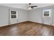 Bright and airy bedroom with hardwood floors and large windows at 4102 S Wellington Dr, Lakeland, FL 33813