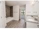 Bathroom with double vanity and a walk-in shower at 4437 Juliana Lake Dr, Auburndale, FL 33823