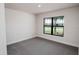 Cozy bedroom with carpet flooring and a window at 4437 Juliana Lake Dr, Auburndale, FL 33823