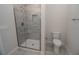 Bathroom with shower and gray tile floor at 4443 Juliana Lake Dr, Auburndale, FL 33823