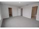 Simple bedroom with gray carpet and double doors at 4443 Juliana Lake Dr, Auburndale, FL 33823