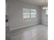 Bright dining room with gray tile floor at 4443 Juliana Lake Dr, Auburndale, FL 33823